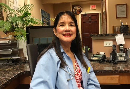 Dr. Cynthia Yango-Eugenio posing in her office.She is an allergist in Buffalo Grove, Algonquin Illinois
 Arlington Heights and Wheeling
 